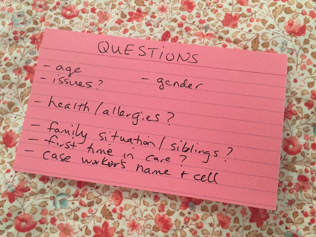 Index cards with title "questions" - age, -gender, -issues?, -health/allergies?, -family situation/ siblings?, -first time in care, -case worker's name and cell