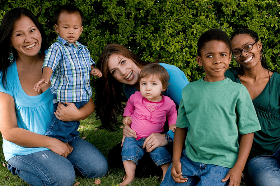 group of moms outdoors with their kids