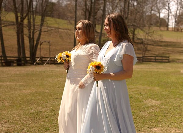 Allison walking Summer down the aisle