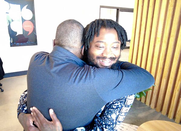 Quan & Ronnie hug