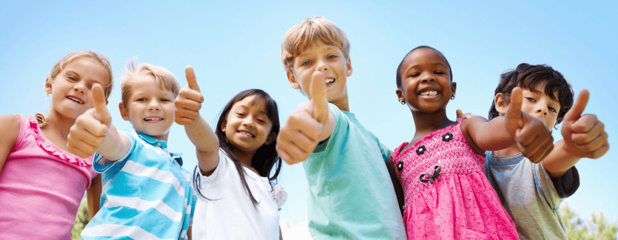 A group of diverse kids giving thumbs up!